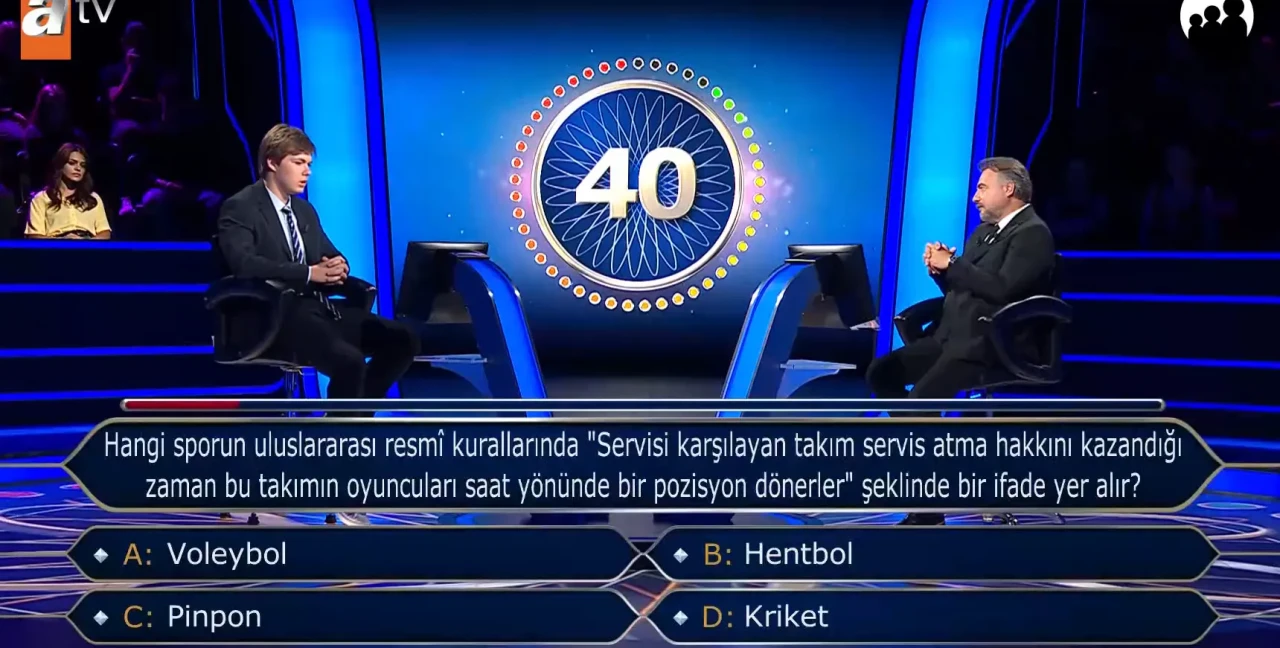 Hangi sporun uluslararası resmî kurallarında "Servisi karşılayan takım servis atma hakkını kazandığı zaman bu takımın oyuncuları saat yönünde bir pozisyon dönerler" şeklinde bir ifade yer alır? Voleybol, Hentbol, Pinpon, Kriket?