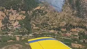 İzmir Kiraz'da ziraat arazisinde başlayan yangın ormana sıçradı