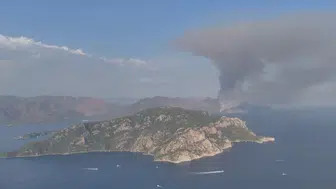 Marmaris’te zamana karşı yarış! Sarp kayalıklardaki alevlere zorlu müdahale