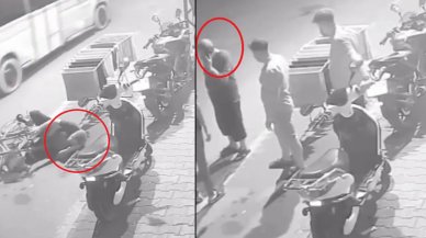 Bisikletten düştü, telefonunu bırakmayıp konuşmaya devam etti