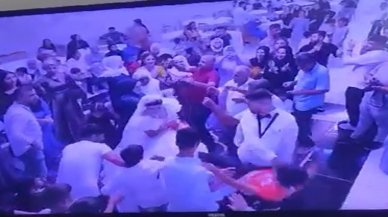 Tepki çeken olay: Damat, para takılı gelinliği çekiştiren çocuğu fırlatıp yere attı