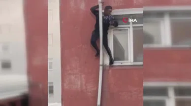 Alevler sardı, çareyi boruya tutunmakta buldu... Metrelerce yükseklikten böyle düştü!