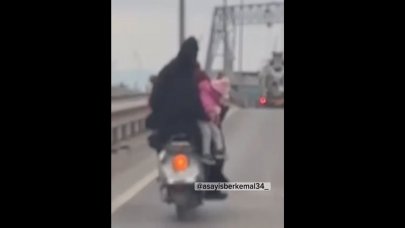 Motor üzerinde tehlikeli yolculuk!