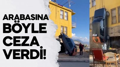 Ceza verdiği otomobilini iki katlı evinin duvarına astı