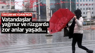 Rüzgar ve yağmur Taksim Meydanı'nda zor anlar yaşattı