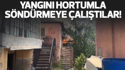Pendik'te gecekondudaki yangını hortumla söndürmeye çalıştılar