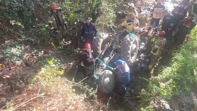 Bursa’da traktör dere yatağına uçtu: 78 yaşındaki sürücü vinçle kurtarıldı