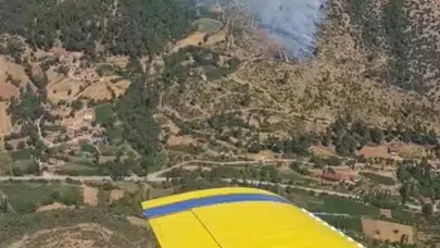 İzmir Kiraz'da ziraat arazisinde başlayan yangın ormana sıçradı