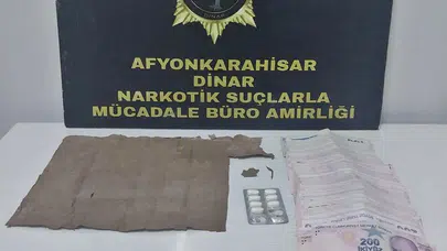 Dinar’da narkotik darbesi: Zehir tacirinin evinden servet çıktı
