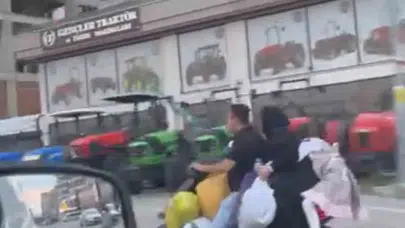 Bursa'da yürekleri ağza getiren görüntü: Scooter üzerinde beş kişi ve onlarca poşet